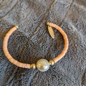 New Plunder bracelet. Peach beads with pearl center.